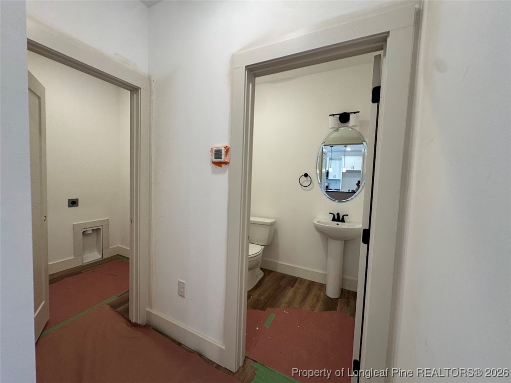 9844 Rockfish Road Raeford, NC 28376 - Photo 3 of 15 a bathroom with a granite countertop toilet and a shower