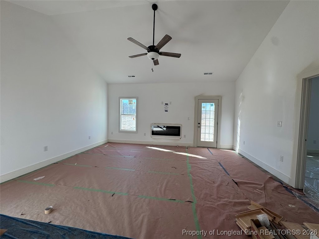 9844 Rockfish Road Raeford, NC 28376 - Photo 5 of 15 a view of empty room with a fireplace