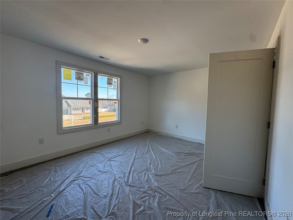 9844 Rockfish Road Raeford, NC 28376 - Photo 9 of 15 an empty room with windows