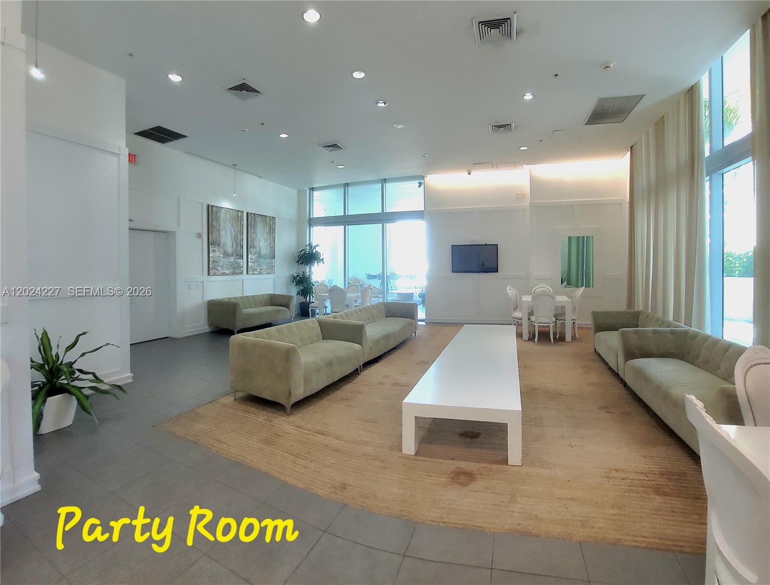 90 Southwest 3rd Street, Unit 2208 Miami, FL 33130 - Photo 36 of 56 a living room with furniture and a large window