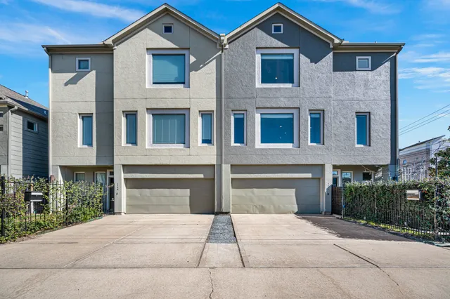 a front view of a house with yard