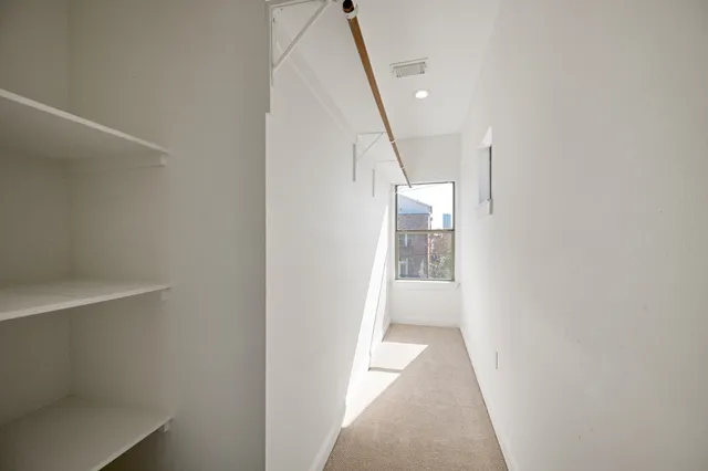 a large bathroom with a granite countertop sink a mirror and shower