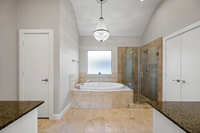 a bathroom with a tub and a shower