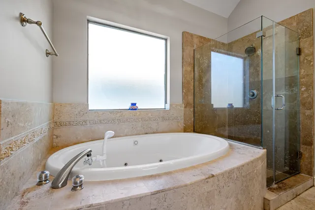 a large bathroom with a granite countertop sink and a mirror
