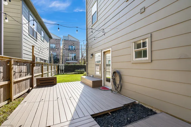 a view of backyard with a deck
