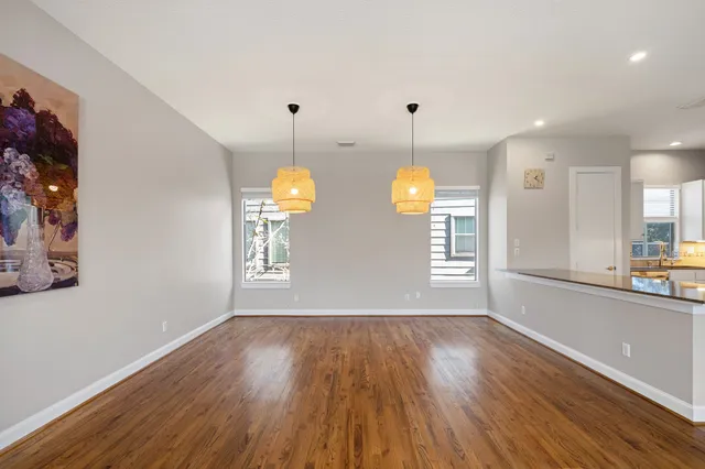 a view of room with window and wooden floor