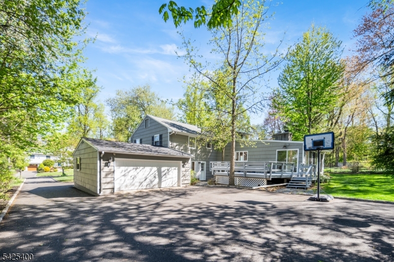 28 Spring Ridge Drive Berkeley Heights, NJ 07922 - Photo 39 of 46 a front view of a house with a yard and garage