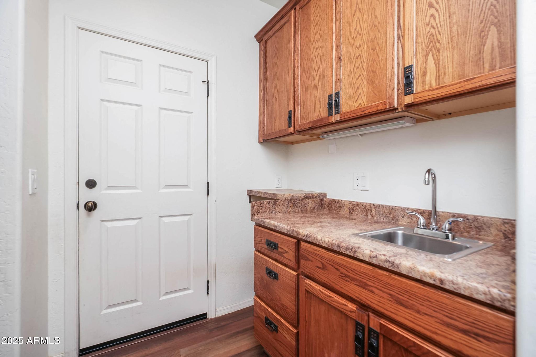 608 Bootleg Road Clarkdale, AZ 86324 - Photo 18 of 111 a kitchen with granite countertop stainless steel appliances white cabinets and a sink