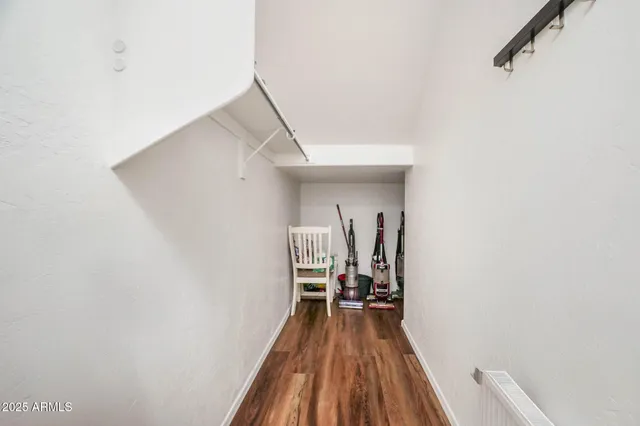 a bathroom with a granite countertop sink a toilet and a mirror