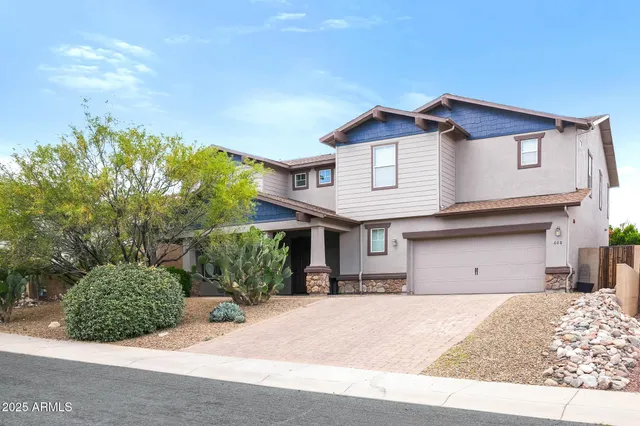 a front view of a house with table and chairs