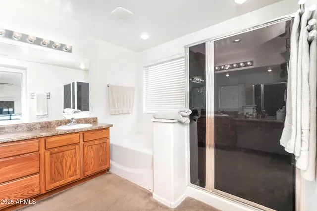 a living room with furniture ceiling fan and a window