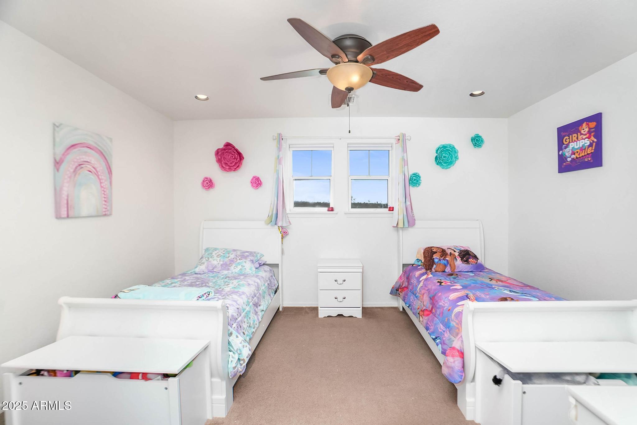 608 Bootleg Road Clarkdale, AZ 86324 - Photo 35 of 111 a bedroom with a bed and a chandelier