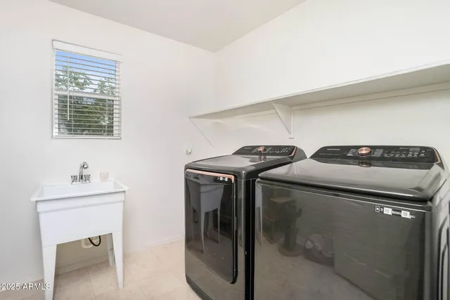 a bedroom with furniture and a baby crib