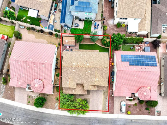 an aerial view of a residential houses with outdoor space and street view