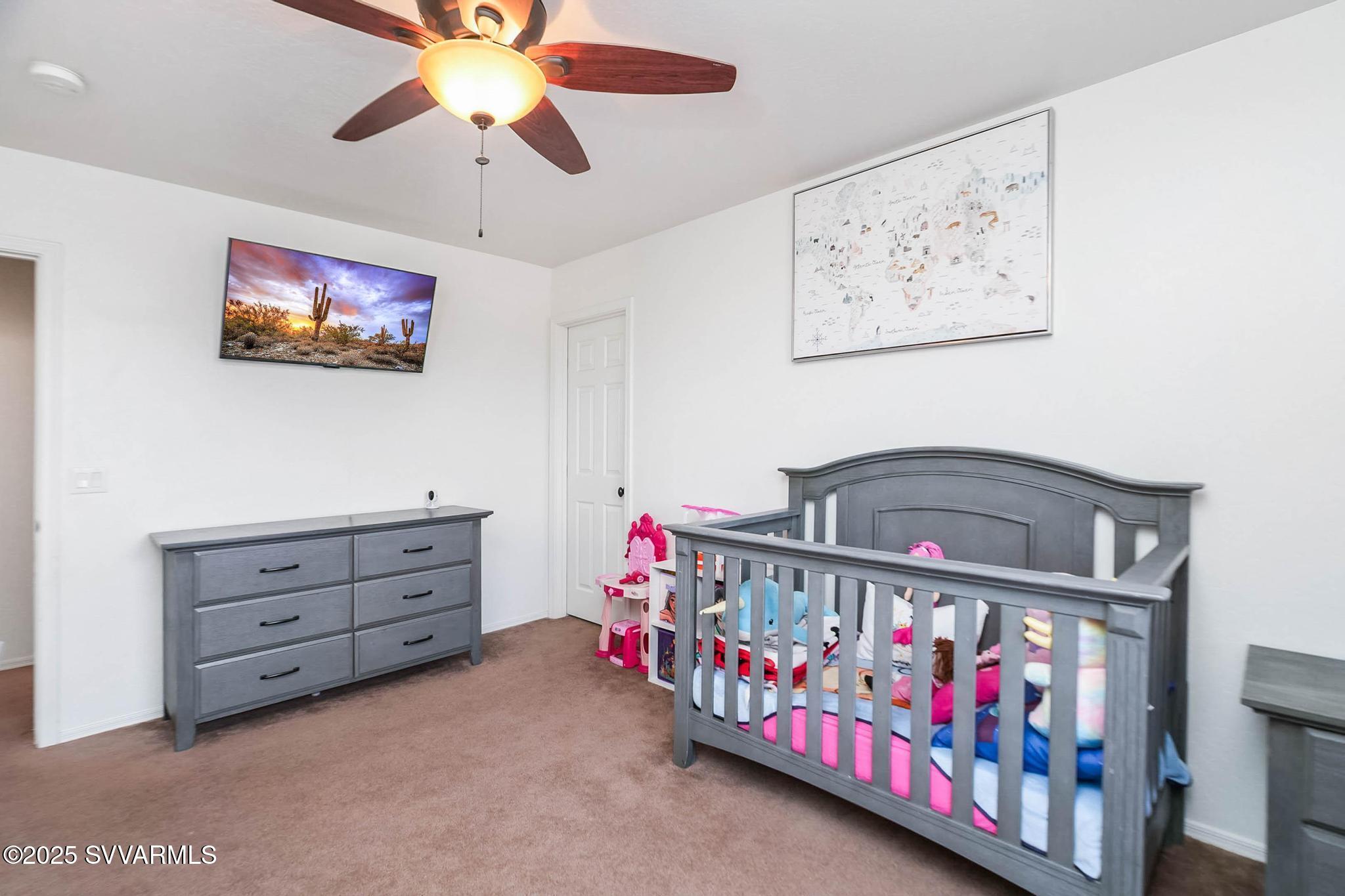 608 Bootleg Road Clarkdale, AZ 86324 - Photo 83 of 111 a bedroom with furniture and a baby crib