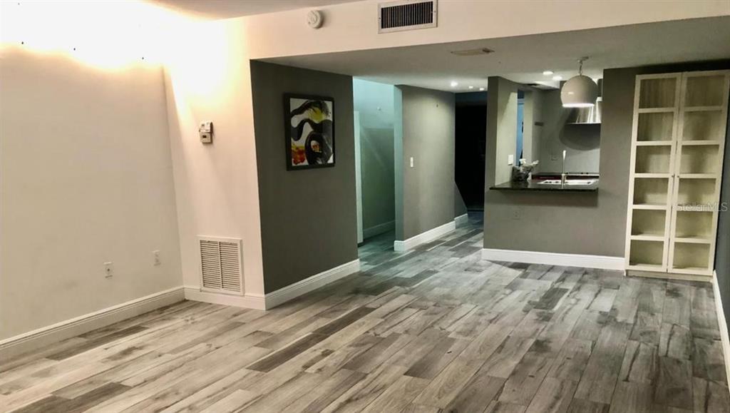 6033 Windhover Drive, Unit D04 Orlando, FL 32819 - Photo 12 of 28 en view interior of the house and wooden floor