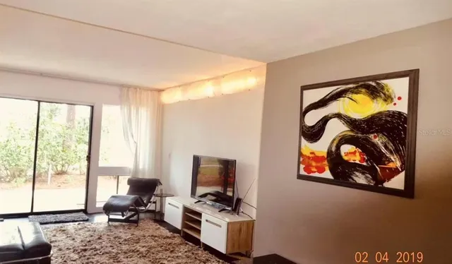 a work room with furniture and a window