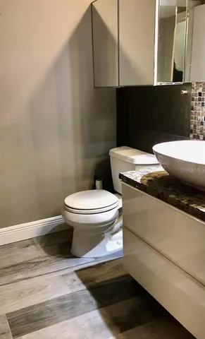 a bathroom with a toilet and shower