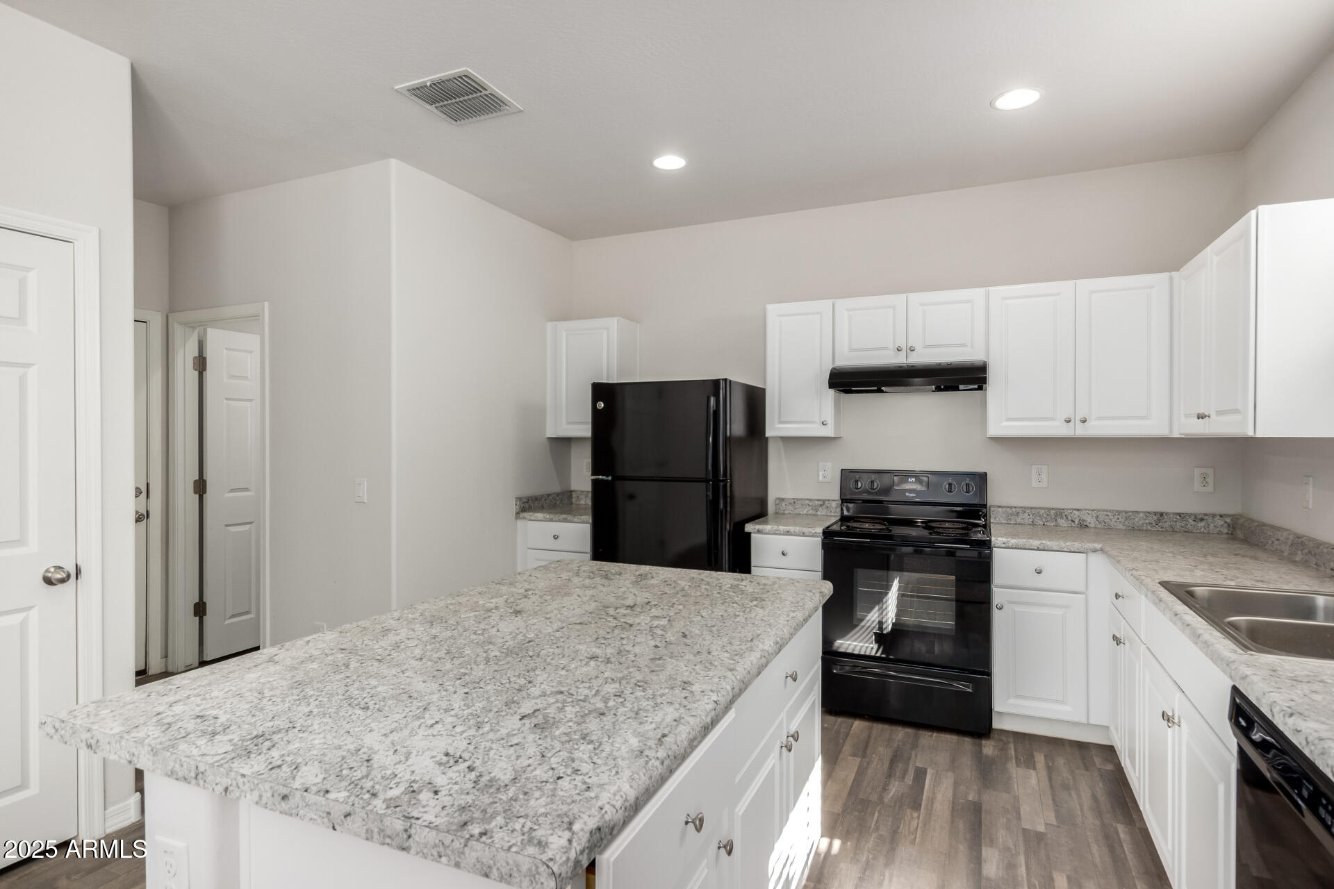 5464 Fulton Street Phoenix, AZ 85043 - Photo 14 of 31 a kitchen with a stove and a refrigerator