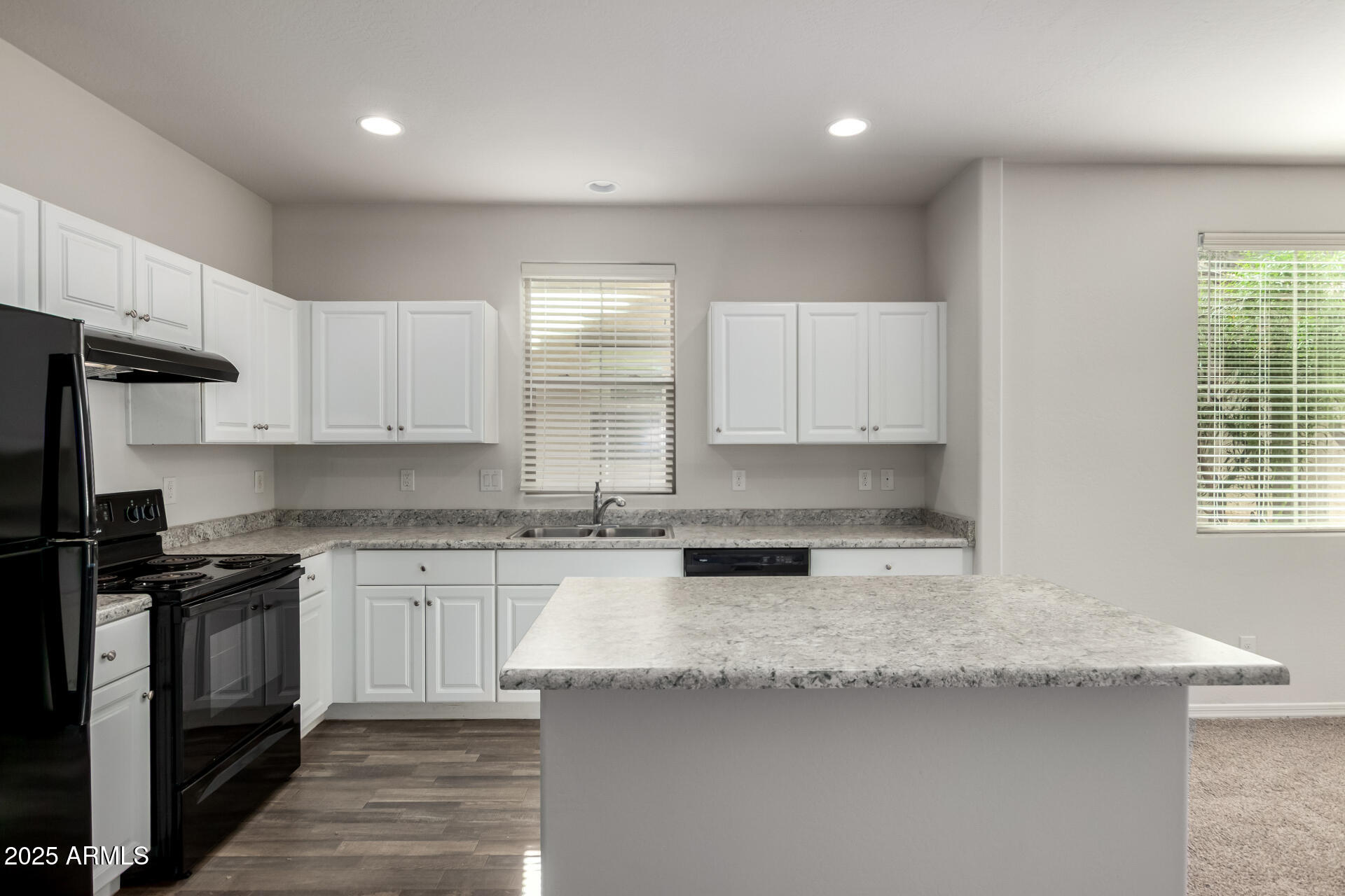 5464 Fulton Street Phoenix, AZ 85043 - Photo 16 of 31 a kitchen with granite countertop a sink a stove and cabinets