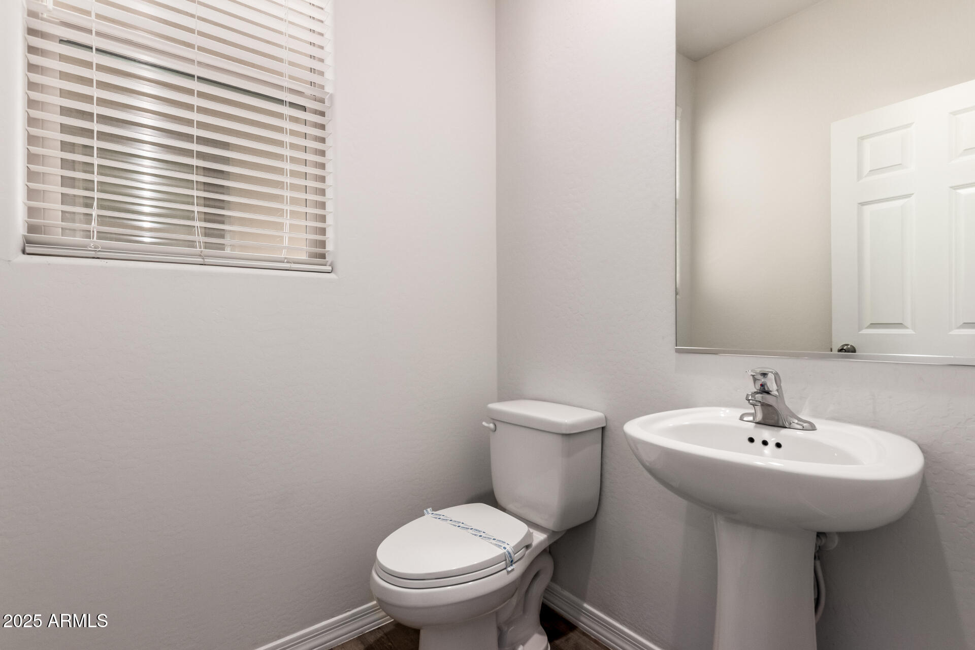 5464 Fulton Street Phoenix, AZ 85043 - Photo 17 of 31 a bathroom with a sink and a toilet