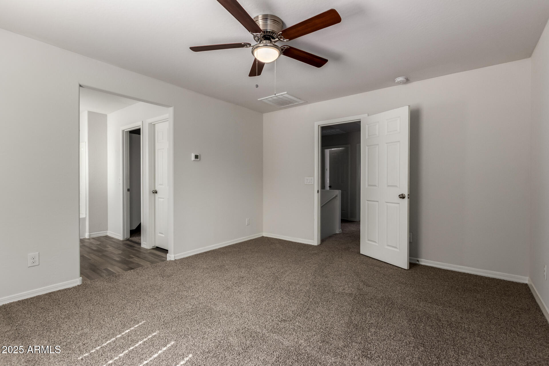 5464 Fulton Street Phoenix, AZ 85043 - Photo 19 of 31 a view of empty room with ceiling fan