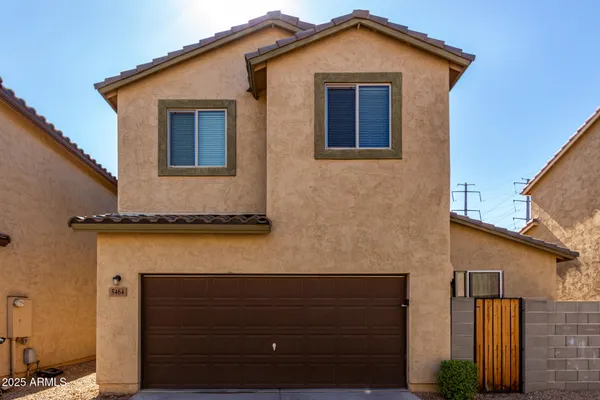 a front view of a house with a garage