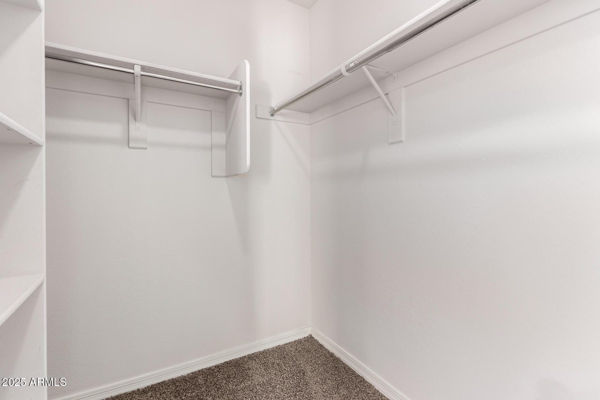 5464 Fulton Street Phoenix, AZ 85043 - Photo 22 of 31 a view of an empty walk in closet