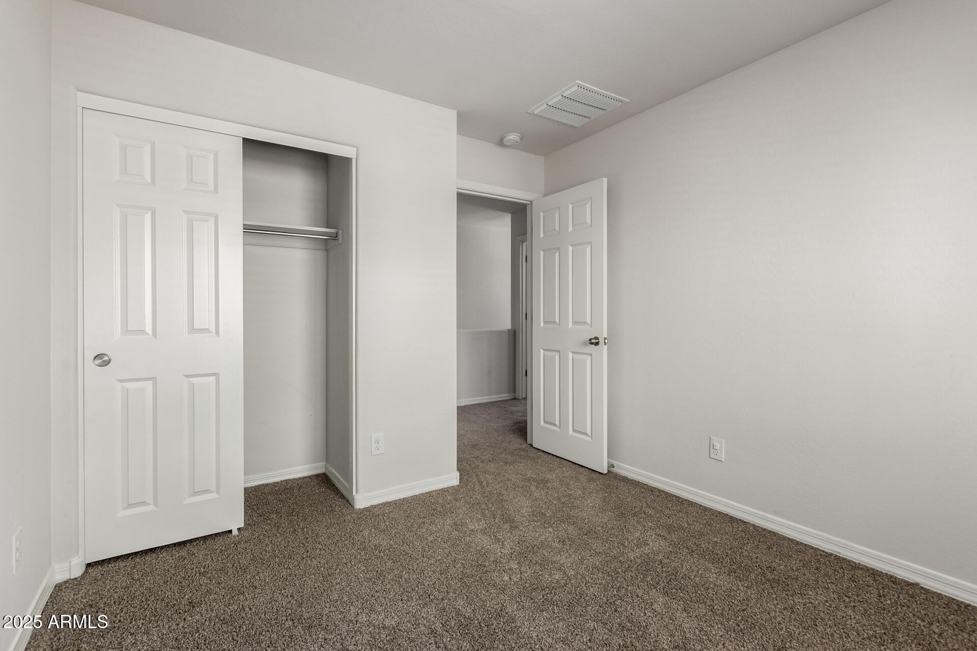 5464 Fulton Street Phoenix, AZ 85043 - Photo 26 of 31 an empty room with closet area