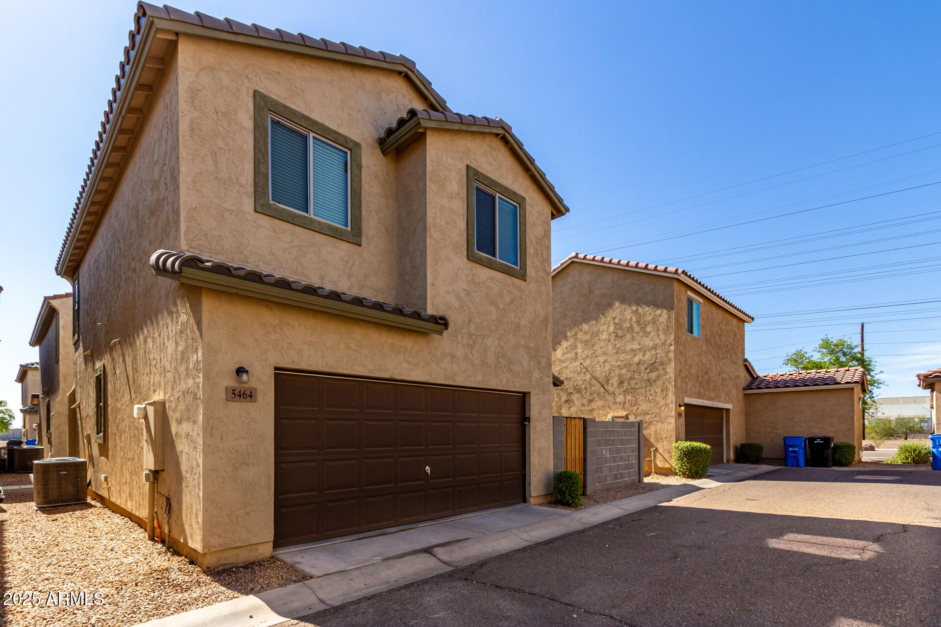 5464 Fulton Street Phoenix, AZ 85043 - Photo 5 of 31 a front view of a house with a garage