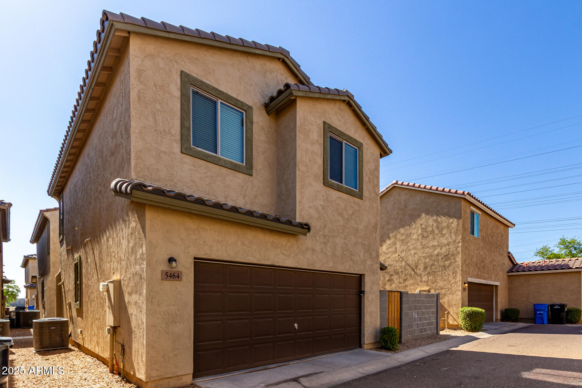 5464 Fulton Street Phoenix, AZ 85043 - Photo 6 of 31 a front view of a house with garage