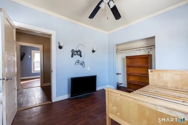 a bedroom with a bed and a dresser