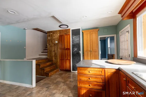 a view of walk in closet and bedroom