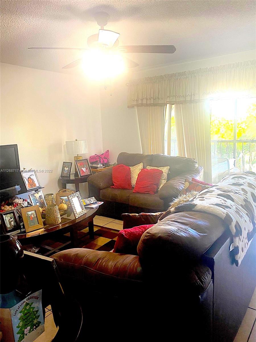Inverrary Lauderhill, FL 33319 - Photo 5 of 9 a living room with furniture and a large window
