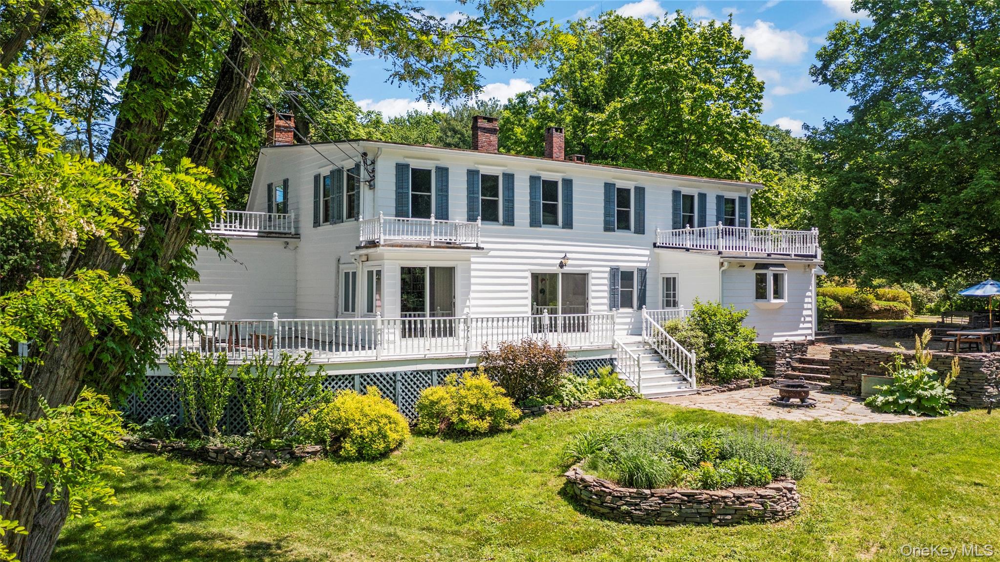 202 Buckwheat Road Hudson, NY 12534 - Photo 2 of 49 a front view of a house with garden
