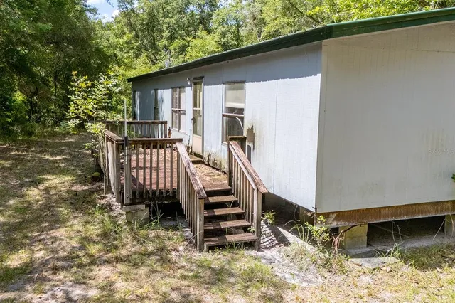 a view of a backyard with a deck