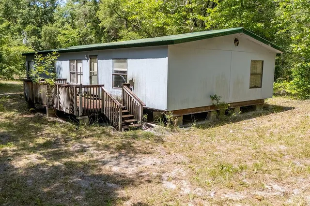 a backyard of a house with lots of green space