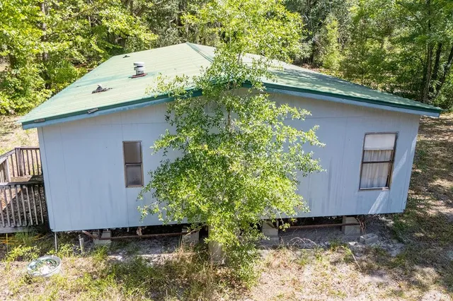 a backyard of a house with lots of green space