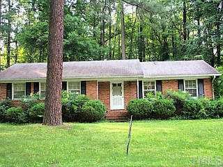 727 Davidson Street Raleigh, NC 27609 - Photo 1 of 1 a view of a house with a yard and potted plants