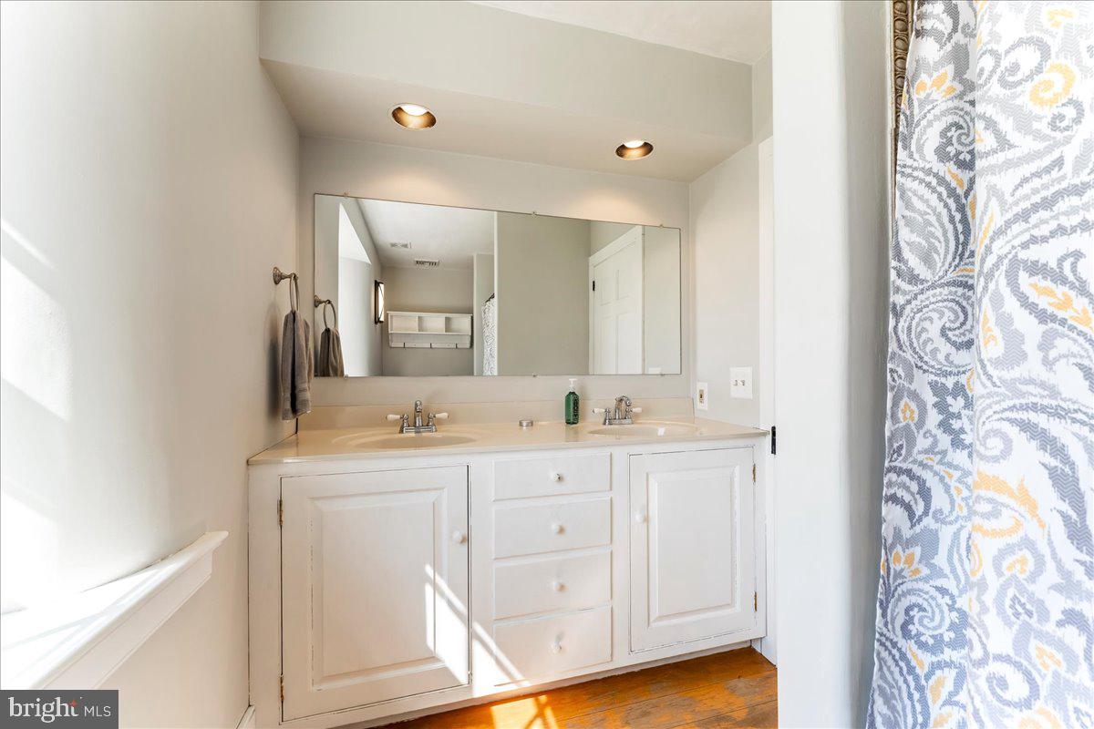 653 Scroggy Road Oxford, PA 19363 - Photo 33 of 81 a bathroom with a granite countertop sink mirror and