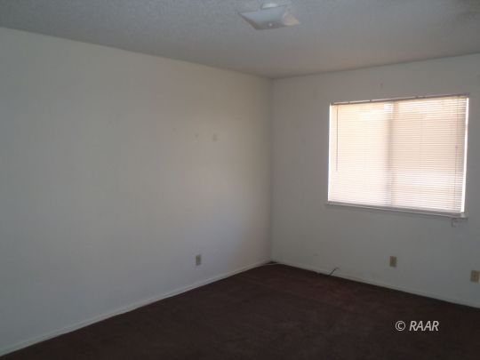 733 Commercial Ridgecrest, CA 93555 - Photo 12 of 15 an empty room with a window