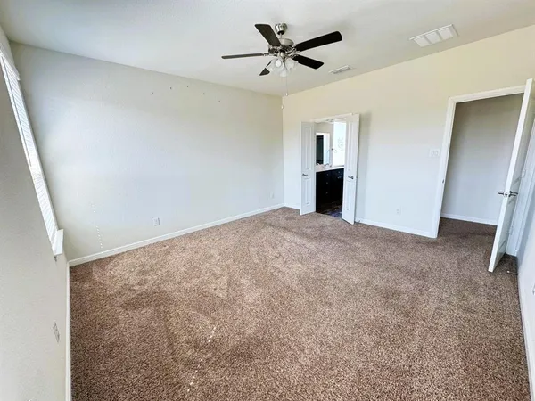 a view of a big room with carpet