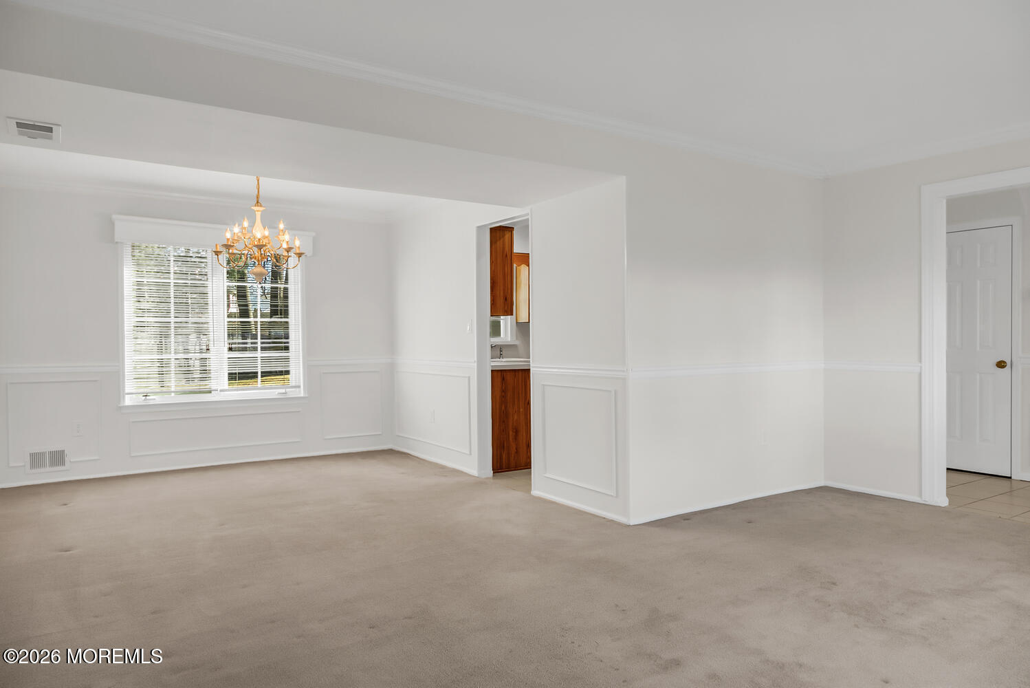 7 Meadow Court Hazlet, NJ 07730 - Photo 16 of 68 an empty room with windows and chandelier