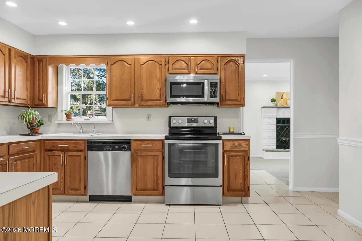 7 Meadow Court Hazlet, NJ 07730 - Photo 21 of 68 a kitchen with stainless steel appliances granite countertop a stove top oven microwave and cabinets
