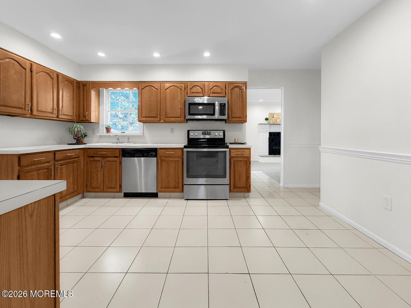 7 Meadow Court Hazlet, NJ 07730 - Photo 22 of 68 a kitchen with stainless steel appliances granite countertop a stove top oven and cabinets