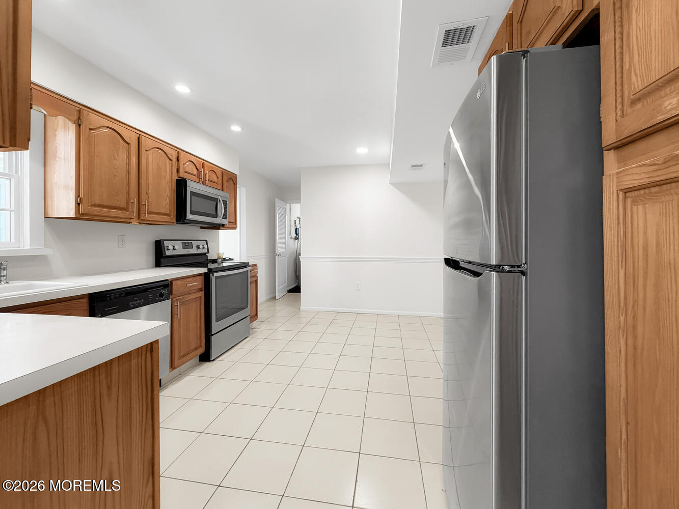 7 Meadow Court Hazlet, NJ 07730 - Photo 26 of 68 a kitchen with stainless steel appliances granite countertop a refrigerator sink and microwave