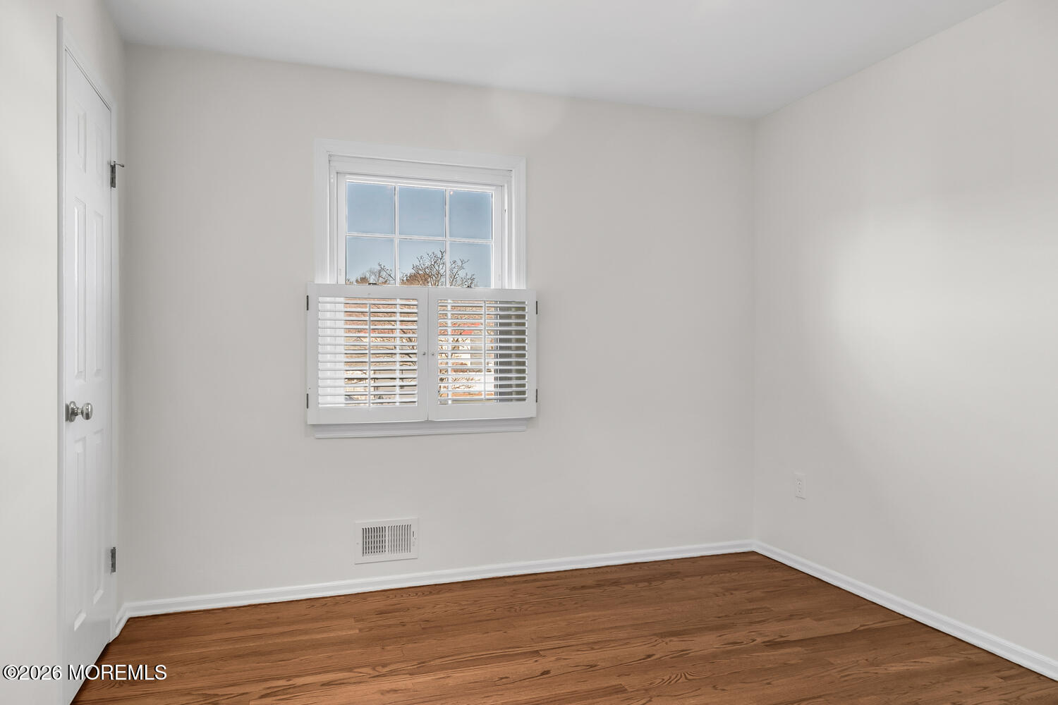 7 Meadow Court Hazlet, NJ 07730 - Photo 36 of 68 a view of an empty room with wooden floor and a window