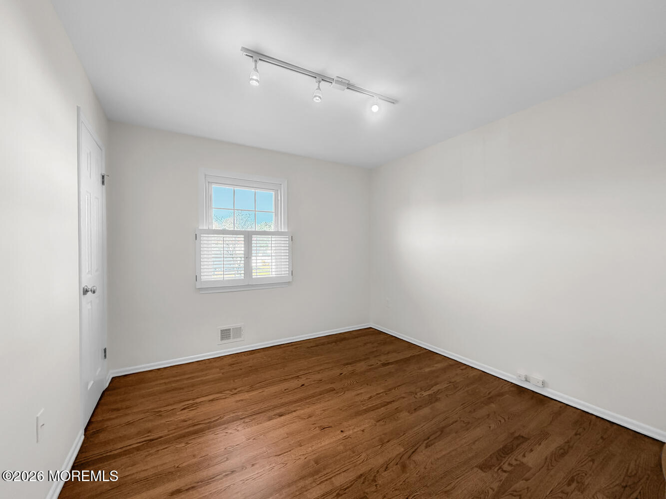 7 Meadow Court Hazlet, NJ 07730 - Photo 37 of 68 an empty room with wooden floor and windows