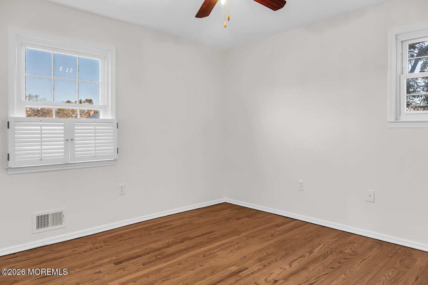 7 Meadow Court Hazlet, NJ 07730 - Photo 38 of 68 an empty room with wooden floor and windows