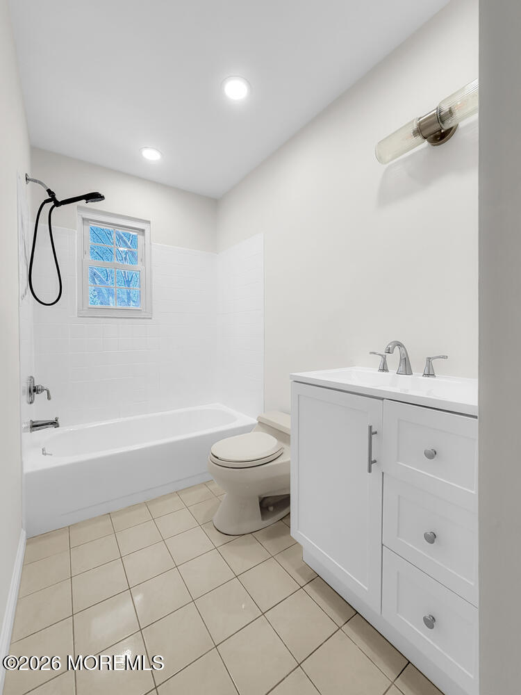 7 Meadow Court Hazlet, NJ 07730 - Photo 42 of 68 a bathroom with a toilet sink and a bathtub